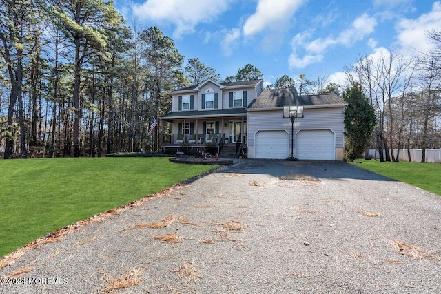 view of front facade with a garage, covered porch, and a front lawn