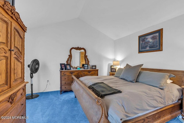 carpeted bedroom with lofted ceiling