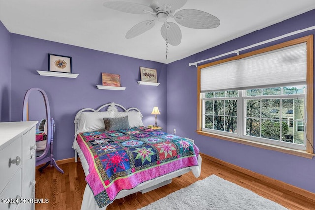 bedroom featuring hardwood / wood-style floors and ceiling fan