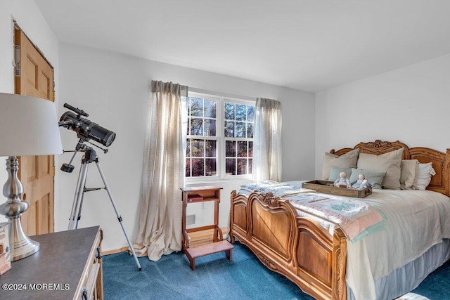 bedroom featuring dark colored carpet