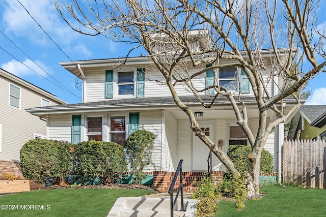 view of front of property with a front lawn