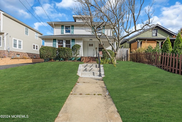 view of front of home with a front lawn