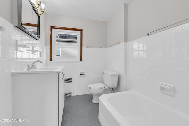 bathroom featuring vanity, radiator, a bathing tub, toilet, and tile walls