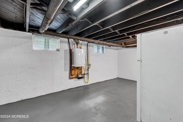 basement with plenty of natural light and water heater