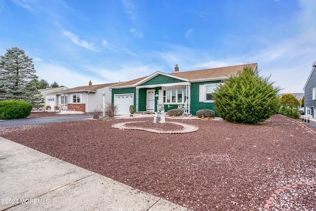 single story home with a garage