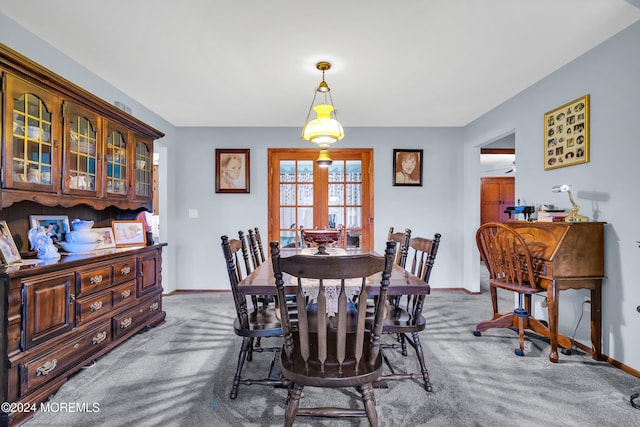 dining area featuring carpet flooring and french doors