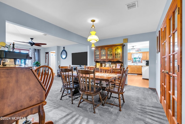 dining room with light hardwood / wood-style flooring and french doors