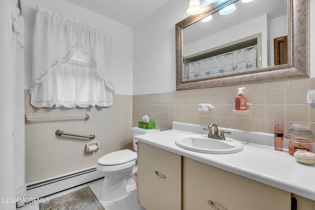 bathroom featuring vanity, toilet, tile walls, and a baseboard heating unit