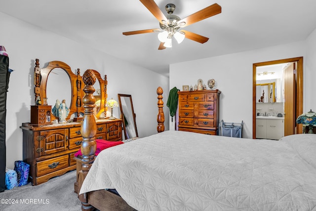 bedroom featuring carpet flooring, ensuite bathroom, and ceiling fan