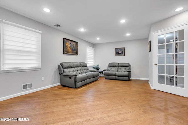 living room with light hardwood / wood-style flooring