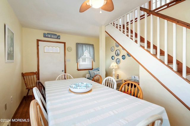 dining room with ceiling fan and dark hardwood / wood-style flooring