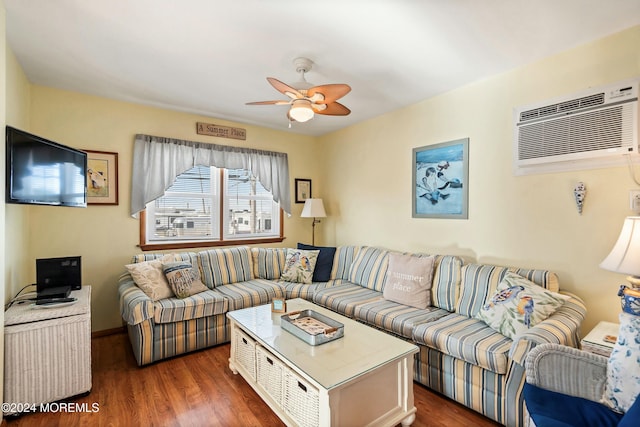 living room with a wall mounted AC, ceiling fan, and dark hardwood / wood-style flooring