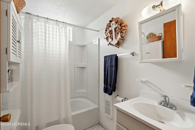 full bathroom featuring shower / bath combo, tile patterned flooring, a textured ceiling, toilet, and vanity