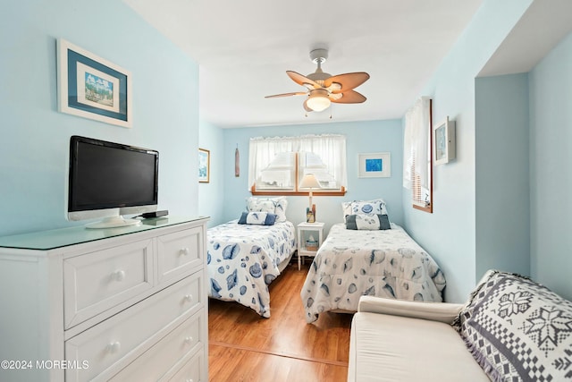 bedroom featuring light wood-type flooring and ceiling fan