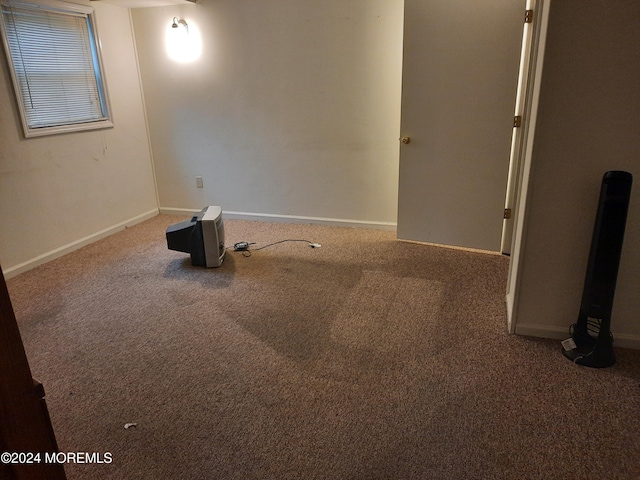 empty room featuring carpet flooring