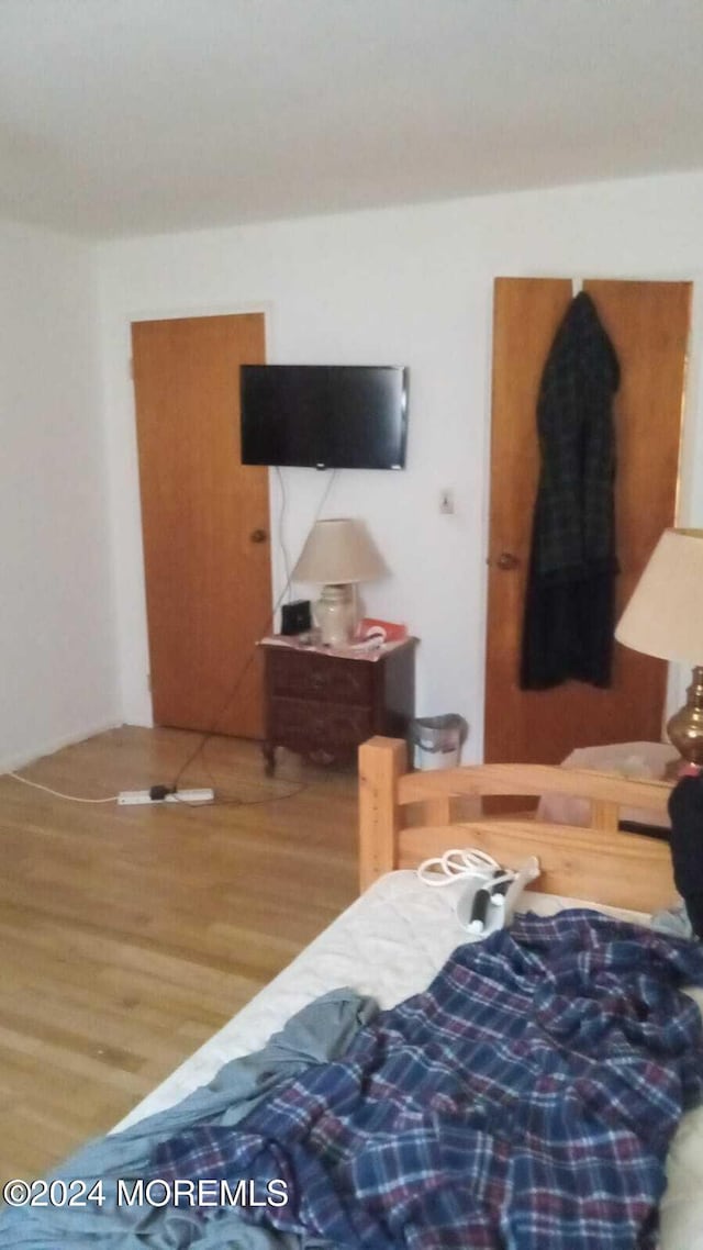 bedroom featuring hardwood / wood-style flooring