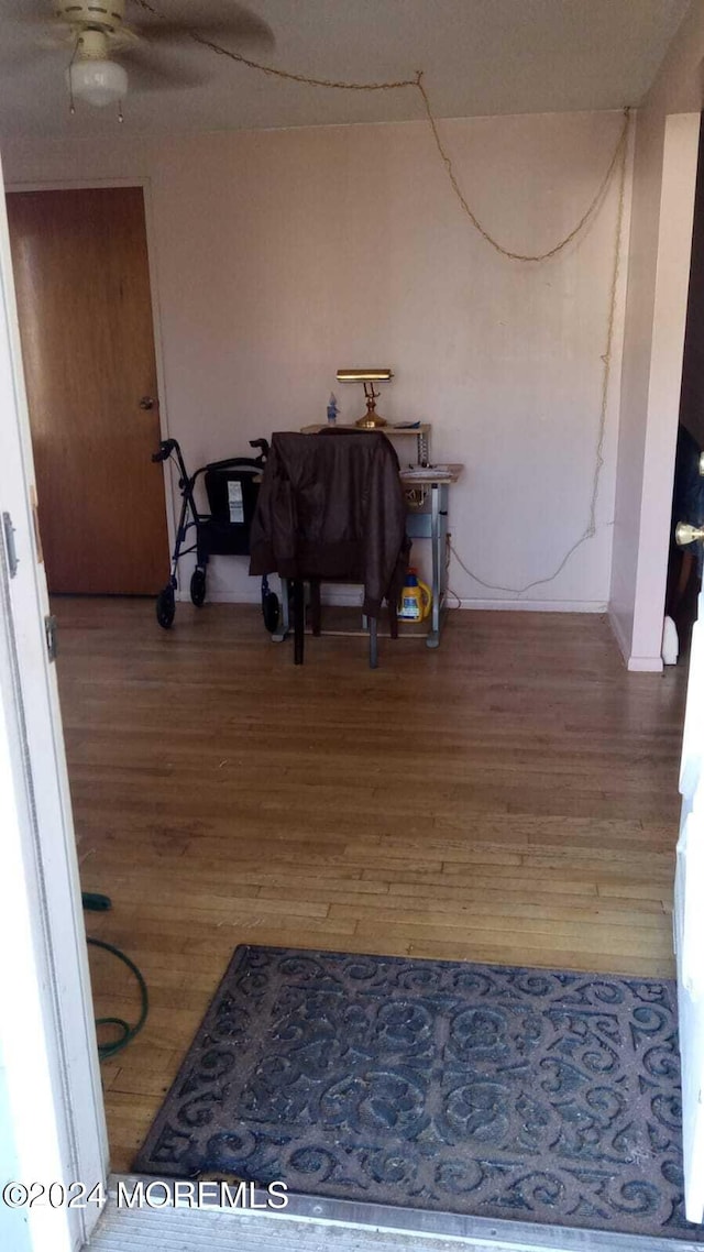 corridor featuring hardwood / wood-style floors