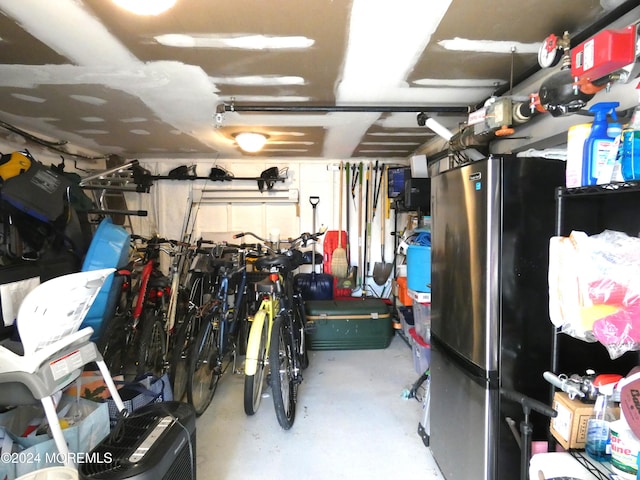 garage featuring stainless steel refrigerator