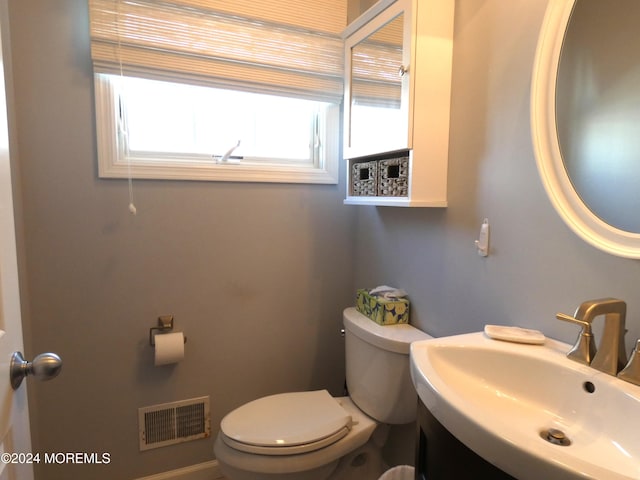 bathroom featuring toilet and sink