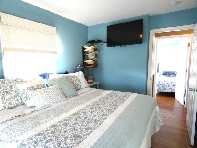 bedroom featuring hardwood / wood-style floors