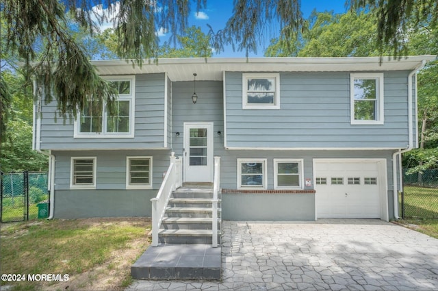 bi-level home featuring a garage