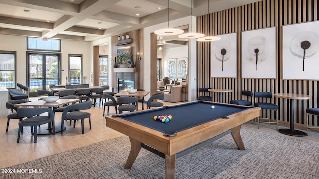 game room featuring a towering ceiling, coffered ceiling, wood-type flooring, beam ceiling, and pool table