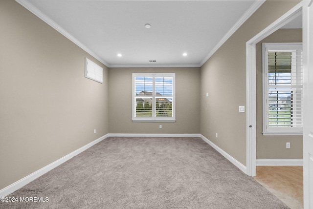 carpeted empty room with ornamental molding