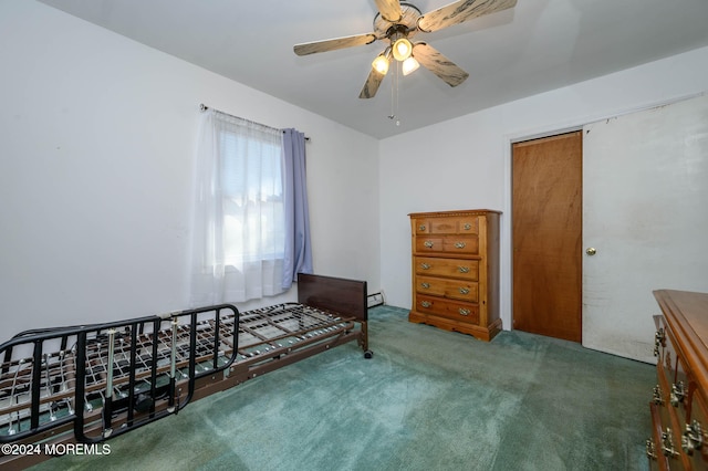 unfurnished bedroom featuring ceiling fan and dark carpet