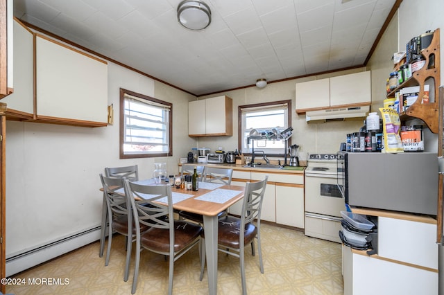 kitchen featuring a healthy amount of sunlight, white cabinetry, white electric stove, and a baseboard radiator