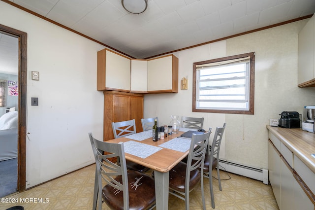 dining room with crown molding and a baseboard radiator