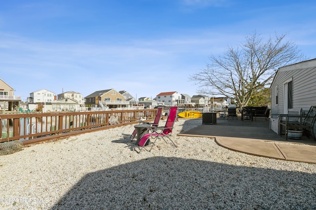 view of yard featuring a patio and a water view