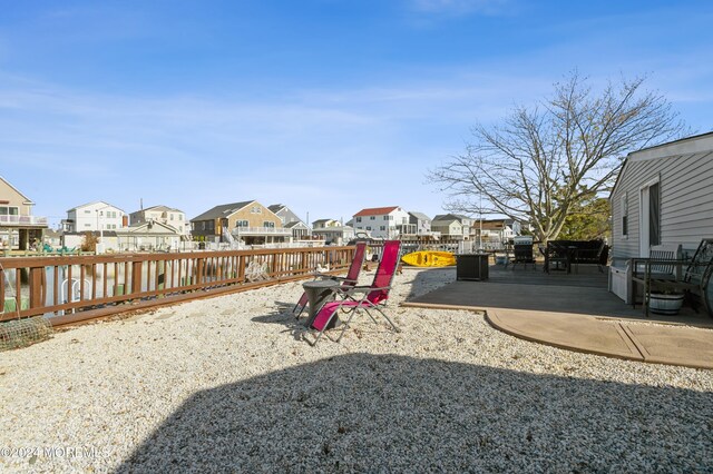 161 N Ensign Dr, Little Egg Harbor, NJ 08087 - fenced backyard with a residential view and a patio