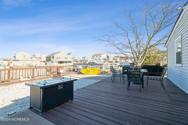 161 N Ensign Dr, Little Egg Harbor, NJ 08087 - wooden deck featuring a residential view and outdoor dining space