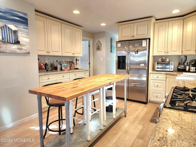 161 N Ensign Dr, Little Egg Harbor, NJ 08087 - kitchen featuring stainless steel appliances, light wood finished floors, recessed lighting, light stone countertops, and baseboards