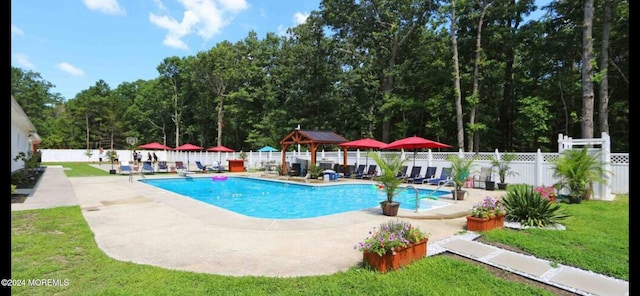 view of swimming pool featuring a gazebo and a patio area