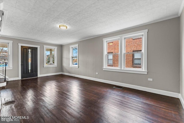 unfurnished room with hardwood / wood-style floors and ornamental molding