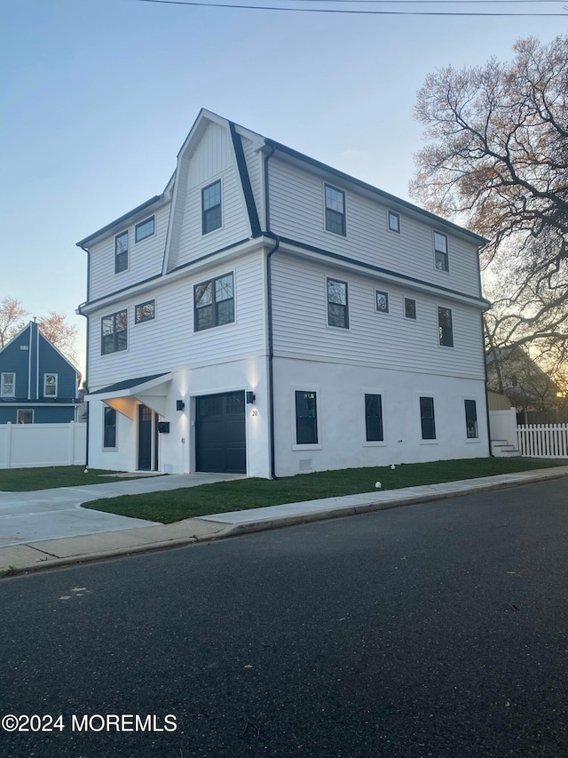 view of front of home with a garage