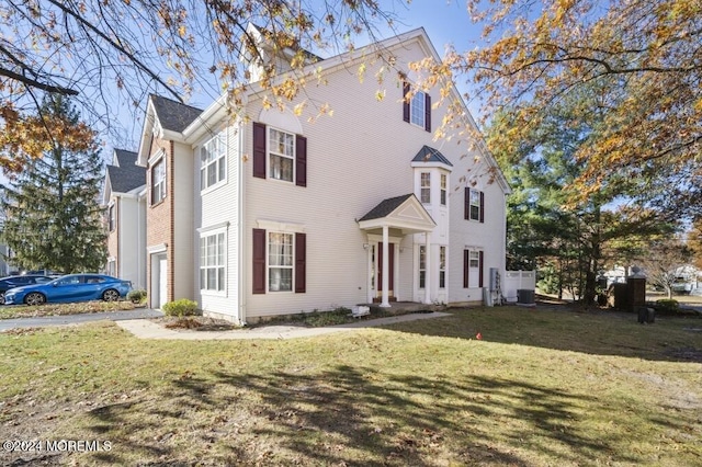 view of front of property with a garage and a front yard