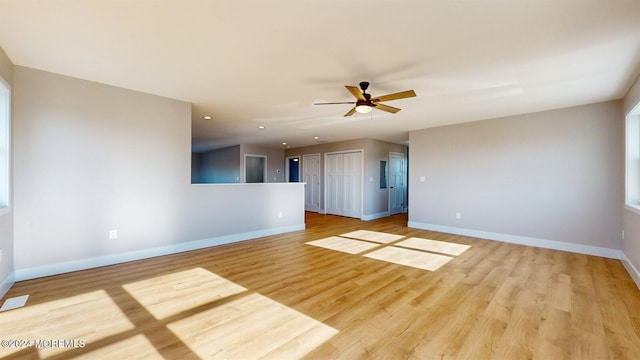 unfurnished room with light wood finished floors, baseboards, a ceiling fan, and recessed lighting