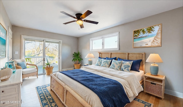 bedroom with access to exterior, ceiling fan, baseboards, and wood finished floors