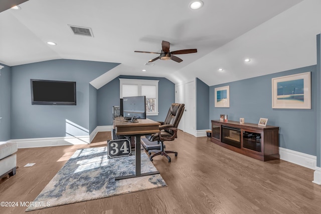 office area featuring ceiling fan, wood-type flooring, and vaulted ceiling