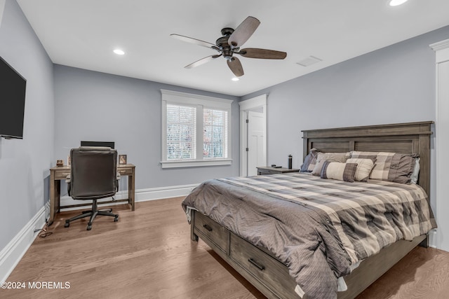 bedroom with ceiling fan and light wood-type flooring