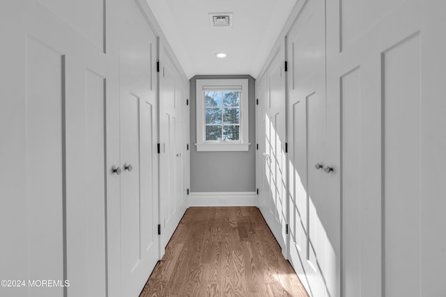 corridor featuring hardwood / wood-style floors