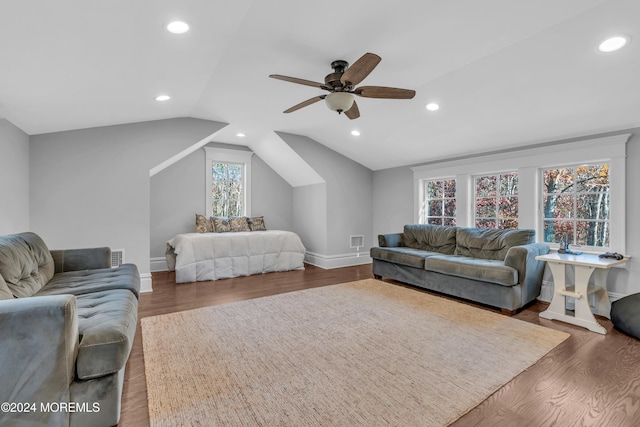 bedroom with ceiling fan, dark hardwood / wood-style flooring, and vaulted ceiling