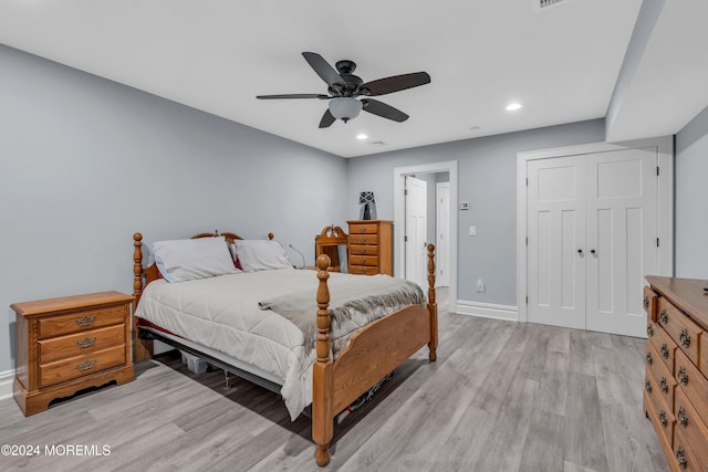 bedroom featuring ceiling fan and light hardwood / wood-style floors