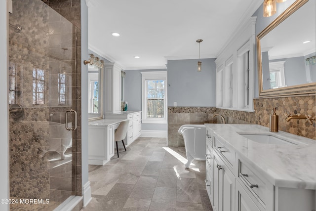 bathroom with vanity, separate shower and tub, tile walls, and ornamental molding