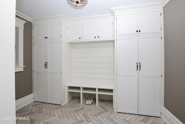 mudroom featuring crown molding