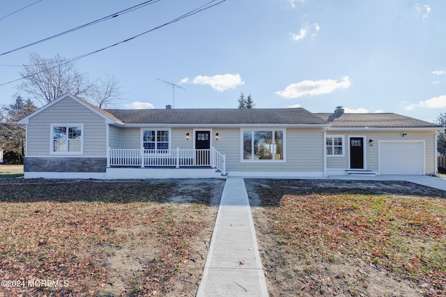 single story home with a front yard and a garage