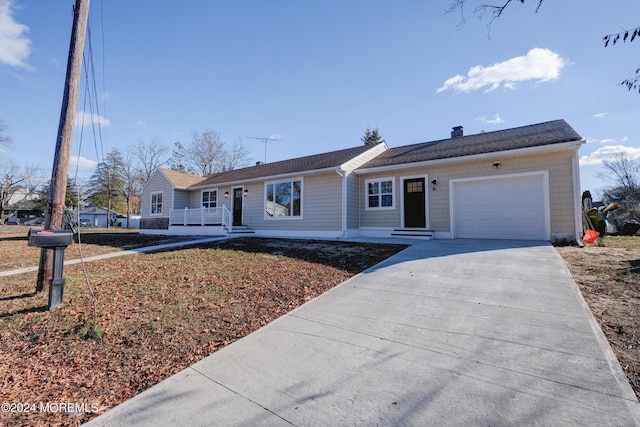 ranch-style home featuring a porch and a garage