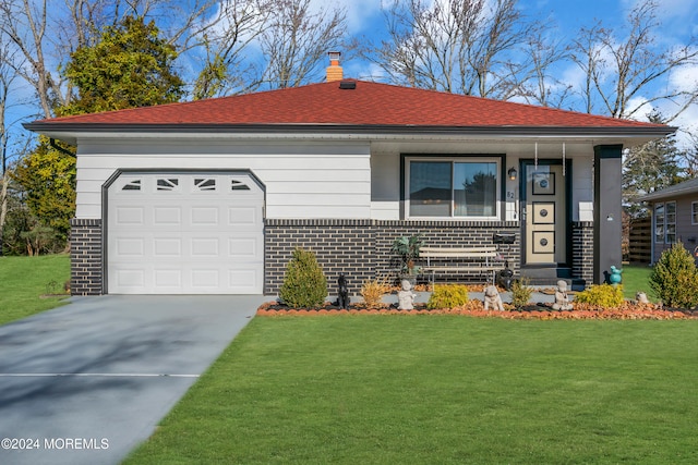 single story home featuring a front yard and a garage